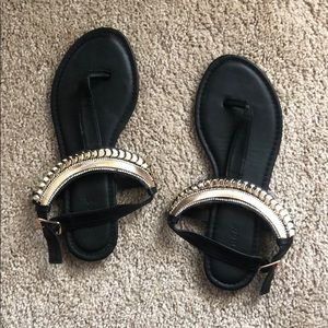Black and gold sandals